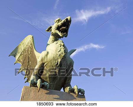 Stock Image - Ljubljana, Slovenia; Green copper dragon statue. Fotosearch
