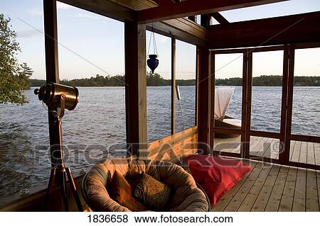 Lounging chairs on a dock View Large Photo Image Stock Photo - Lounging chairs on a dock. Fotosearch