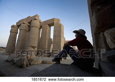 Luxor, Egypt; Man with hat visiting the Ramesseum View Large Photo Image Stock Image - Luxor, Egypt; Man with hat visiting the Ramesseum. Fotosearch