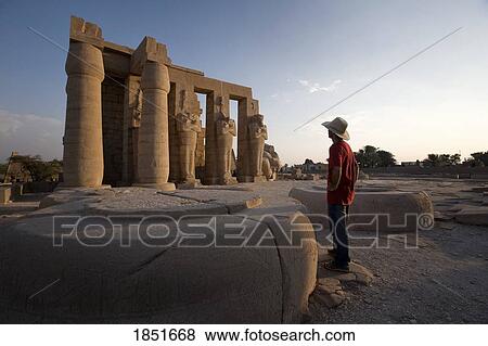 Luxor, Egypt; The Ramesseum, A tourist enjoying the view View Large Photo Image Stock Photo - Luxor, Egypt; The Ramesseum, A tourist enjoying the view. Fotosearch