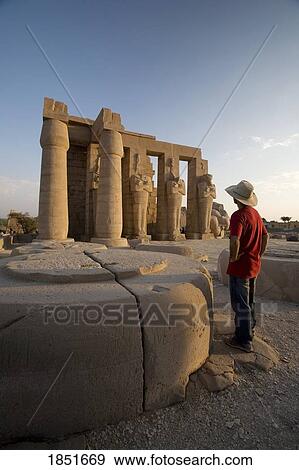 Luxor, Egypt; The Ramesseum, A tourist enjoying the view View Large Photo Image Stock Photo - Luxor, Egypt; The Ramesseum, A tourist enjoying the view. Fotosearch