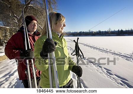 Stock Photography - Man and woman; Couple with skis. Fotosearch