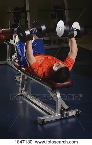 Man lifting weights View Large Photo Image Stock Image - Man lifting weights. Fotosearch
