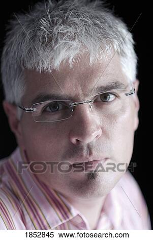 Stock Photography - Man; Portrait of man wearing glasses. Fotosearch