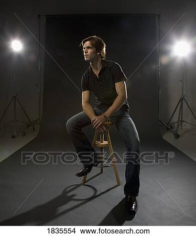 Picture - Man posing in studio. Fotosearch