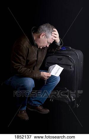 Man with suitcase; Man who is leaving View Large Photo Image Stock Photo - Man with suitcase; Man who is leaving. Fotosearch