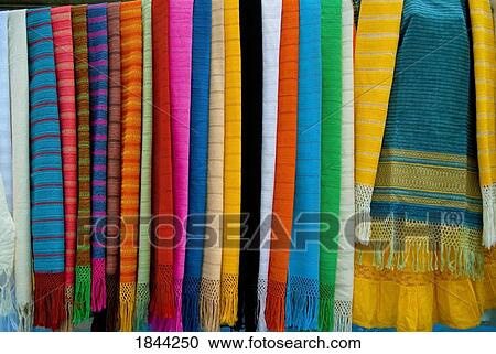 Stock Image - Mexico; Colorful clothes on a rack. Fotosearch