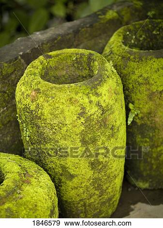 Stock Photo - Moss covered urns. Fotosearch