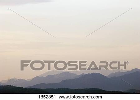 Mountains; Mountain ranges at dusk View Large Photo Image Stock Image - Mountains; Mountain ranges at dusk . Fotosearch