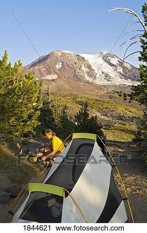 Stock Image - Mt Adams Wilderness, Washington State, USA; Camper and Mt Adams. Fotosearch