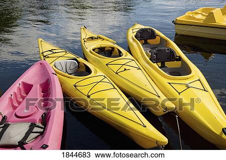 Muskokas, Ontario, Canada; Empty kayaks in water View Large Photo Image Stock Image - Muskokas, Ontario, Canada; Empty kayaks in water. Fotosearch