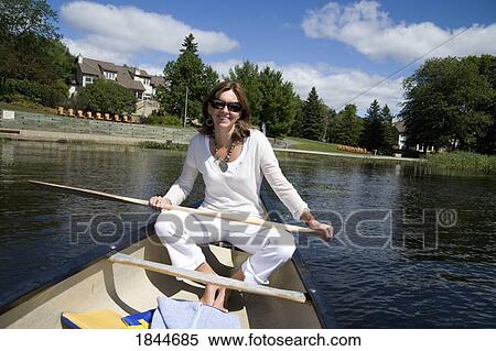 Muskokas, Ontario, Canada; Woman in a canoe View Large Photo Image Stock Photography - Muskokas, Ontario, Canada; Woman in a canoe. Fotosearch