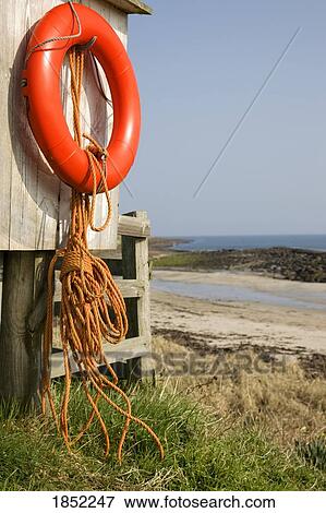 Stock Photo - Northumberland, England, Life preserver at the beach. Fotosearch