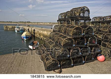 Stock Photography - Northumberland, England; Lobster traps piled up on a pier. Fotosearch