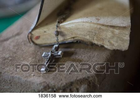 Stock Photo - Old Bible and rosary. Fotosearch