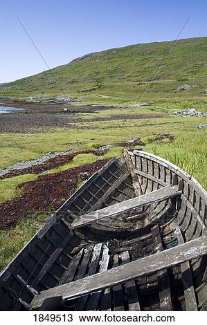 Stock Image - Old rowboat in a field. Fotosearch