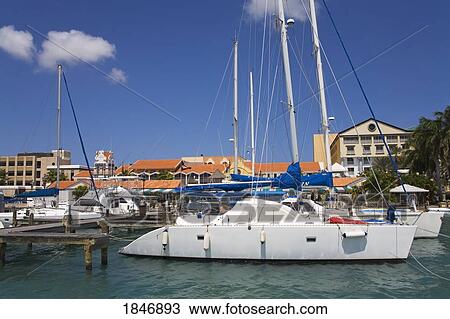 Stock Image - Oranjestad City, Aruba, Caribbean; Yacht in harbor . Fotosearch