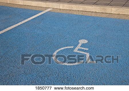 Stock Photo - Parking space reserved for handicapped driver. Fotosearch