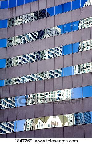 Stock Photo - Pershing Square, Downtown Los Angeles, California, USA; Skyscraper reflection on the glass. Fotosearch