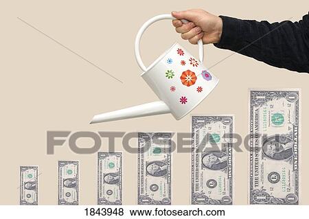 Person watering paper currency View Large Photo Image Stock Photo - Person watering paper currency. Fotosearch