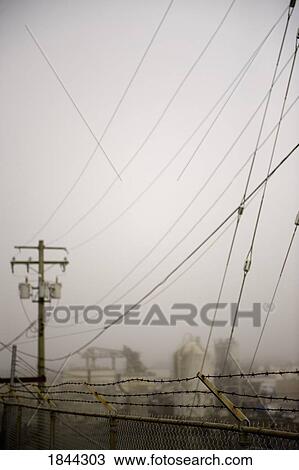 Power station surrounded by barbed wire fences View Large Photo Image Stock Image - Power station surrounded by barbed wire fences. Fotosearch