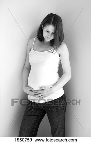 Stock Photo - Pregnancy; Portrait of a pregnant woman. Fotosearch