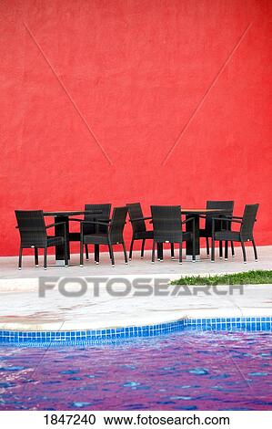 Puerto Vallarta, Mexico; Chairs and tables by a pool View Large Photo Image Stock Image - Puerto Vallarta, Mexico; Chairs and tables by a pool . Fotosearch
