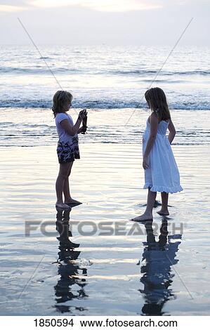 Picture - Puerto Vallarta, Mexico; Children on the beach . Fotosearch