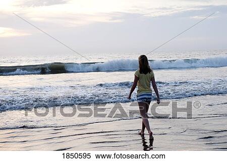 Puerto Vallarta, Mexico; Teen girl walking on the beach View Large Photo Image Stock Photography - Puerto Vallarta, Mexico; Teen girl walking on the beach . Fotosearch