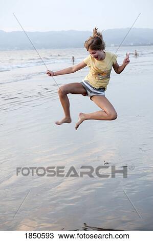 Puerto Vallarta, Mexico; Teen playing in the water View Large Photo Image Stock Image - Puerto Vallarta, Mexico; Teen playing in the water . Fotosearch