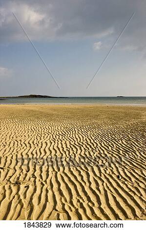 Stock Photo - Rippled sand on a beach, Northumberland, England. Fotosearch
