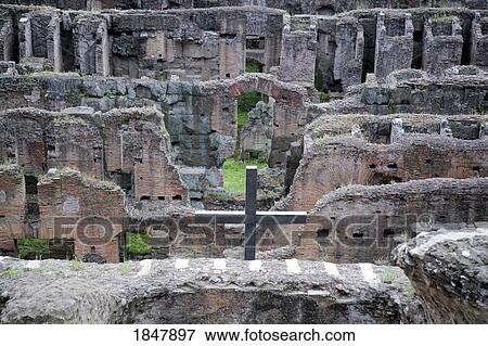 Rome, Italy; Metal cross erected in the catacombs of the Colosseum View Large Photo Image Stock Photo - Rome, Italy; Metal cross erected in the catacombs of the Colosseum. Fotosearch