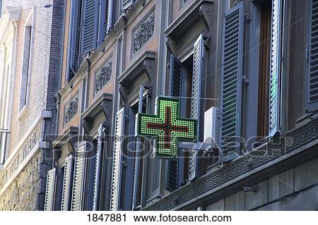 Stock Image - Rome, Italy; Red and Green Medical Cross on building. Fotosearch
