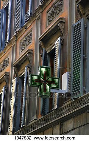 Stock Image - Rome, Italy; Red and Green Medical Cross on building. Fotosearch