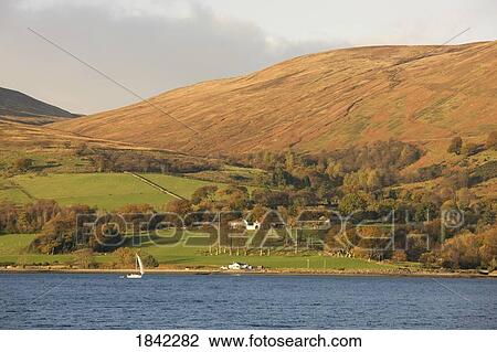 Stock Image - Sailboat in the water, Argyll and Bute, Scotland. Fotosearch