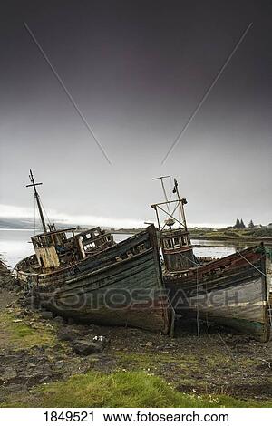Stock Image - Scotland; Shipwreck on the shore. Fotosearch