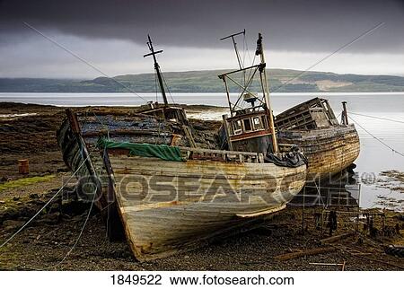 Stock Image - Scotland; Three boats on shore. Fotosearch