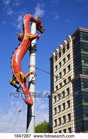 Seattle, Washington State, USA; Dragon on pole in Chinatown International District View Large Photo Image Stock Photo - Seattle, Washington State, USA; Dragon on pole in Chinatown International District . Fotosearch