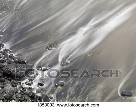 Shoreline; Water lapping up against a rocky shoreline View Large Photo Image Stock Image - Shoreline; Water lapping up against a rocky shoreline. Fotosearch