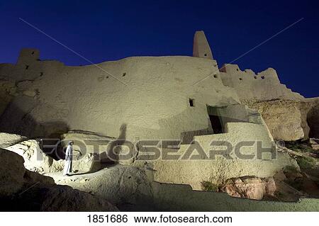 Stock Photograph - Siwa Oasis, Egypt; A local Siwan young man in traditional dress at the Temple of the Oracle. Fotosearch