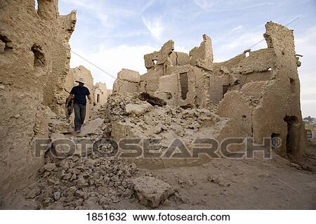 Siwa Oasis, Egypt; Man exploring the ruins View Large Photo Image Stock Image - Siwa Oasis, Egypt; Man exploring the ruins. Fotosearch