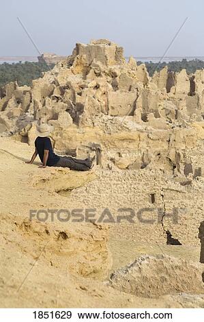 Stock Photo - Siwa Oasis, Shali, Egypt; A man, Man enjoying the view. Fotosearch
