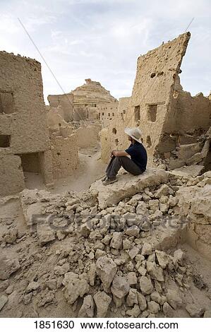 Siwa, Siwa Oasis, Egypt; Man overlooking Fortress of Shali View Large Photo Image Stock Image - Siwa, Siwa Oasis, Egypt; Man overlooking Fortress of Shali. Fotosearch