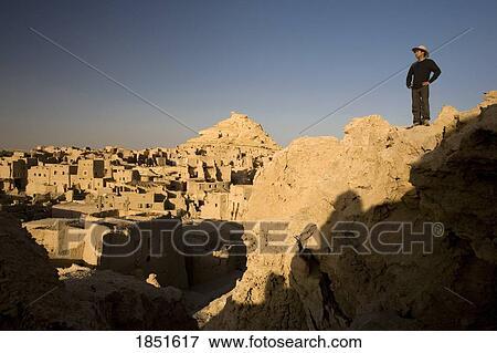 Siwa Town, Libyan Desert, Egypt; A man standing on the Fortress of Shali View Large Photo Image Stock Photo - Siwa Town, Libyan Desert, Egypt; A man standing on the Fortress of Shali. Fotosearch