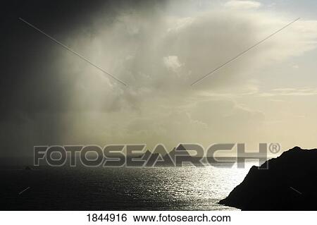 Stock Photograph - Skellig Islands, Co Kerry, Ireland; Islands in a rain shower. Fotosearch