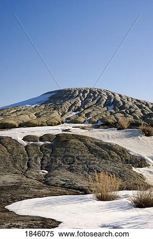 Stock Photography - Snow on the ground, Drumheller, Alberta, Canada. Fotosearch