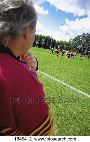 Soccer coach watching a game View Large Photo Image Stock Image - Soccer coach watching a game. Fotosearch