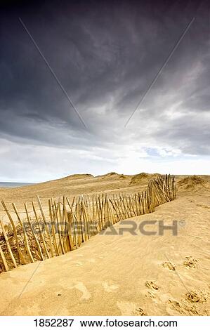 South Shields, Tyne and Wear, England; Dark skies over beach with fence View Large Photo Image Stock Photo - South Shields, Tyne and Wear, England; Dark skies over beach with fence. Fotosearch