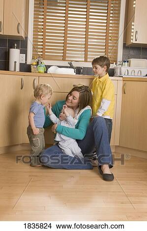 Stay-at-home mother with her children View Large Photo Image Picture - Stay-at-home mother with her children. Fotosearch