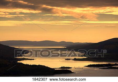 Sunset over water, Argyll and Bute, Scotland View Large Photo Image Stock Photo - Sunset over water, Argyll and Bute, Scotland. Fotosearch